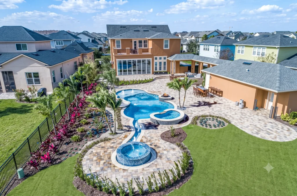 Freeform pool with hot tub and spool on with no pool design mistakes due to proper backyard evaluation.