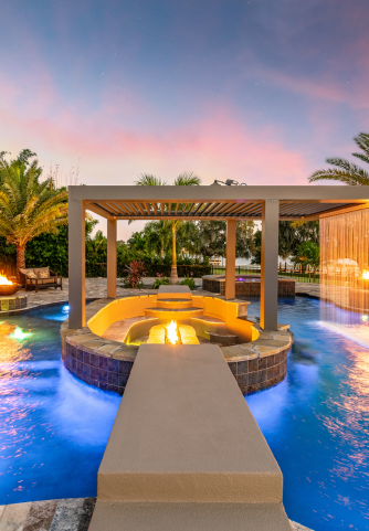 Pool bar in a pool with linear fire pit