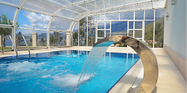 Water Spill feature going into a pool out of a chrome fountain head