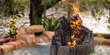Fire pit by pools fire feature in Florida