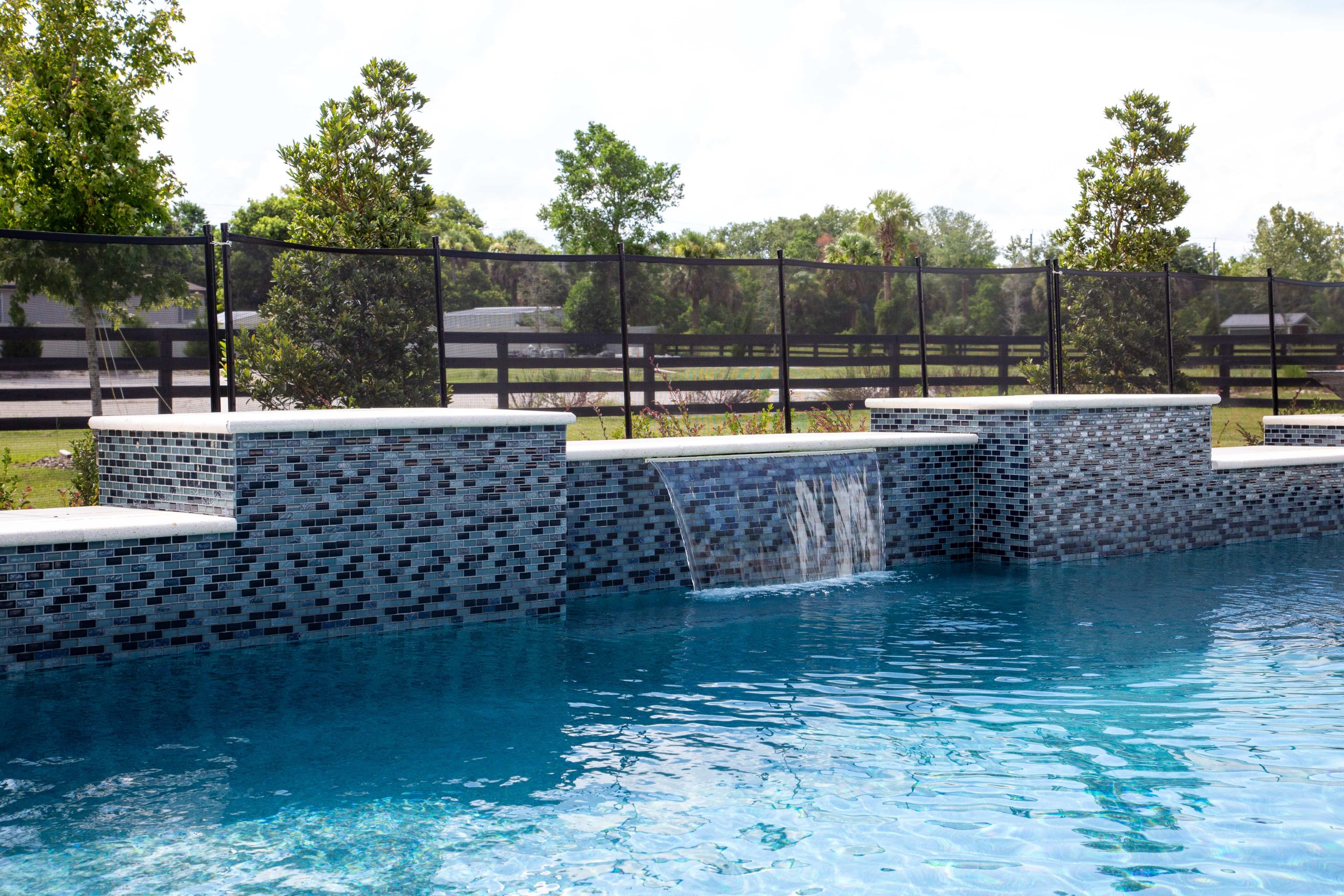 The Villages Waterfall Feature pouring into pool