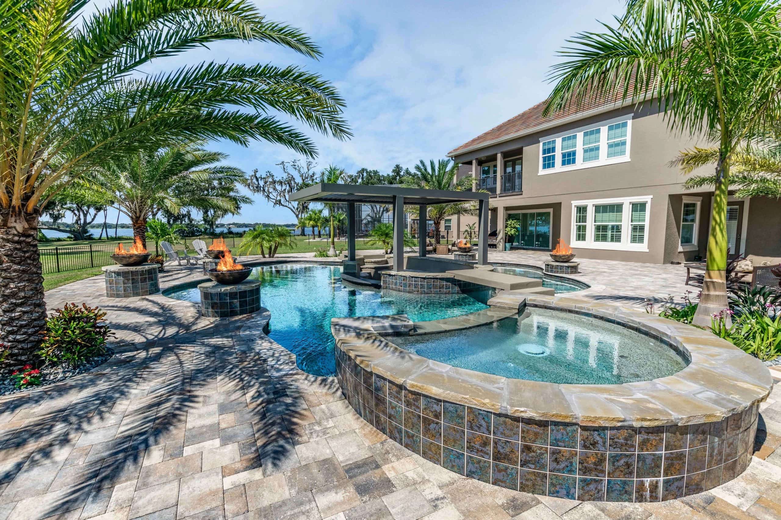 Winter garden pool builder finished project in large backyard with fire feature and pool bar