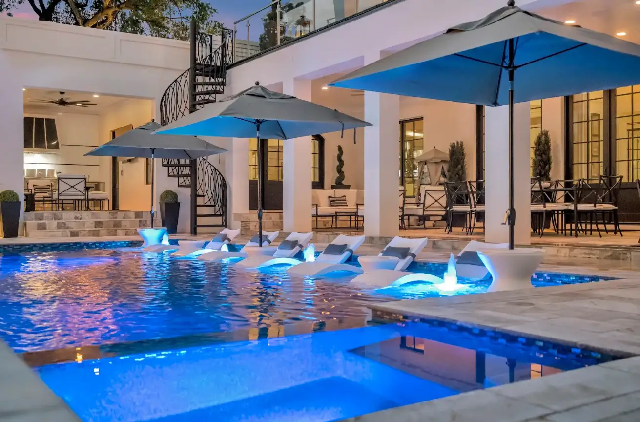 Sun shelf pool at dusk with bubble and led lighting